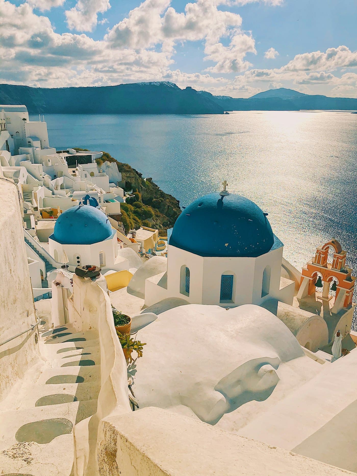 White houses and blue domes above the sea